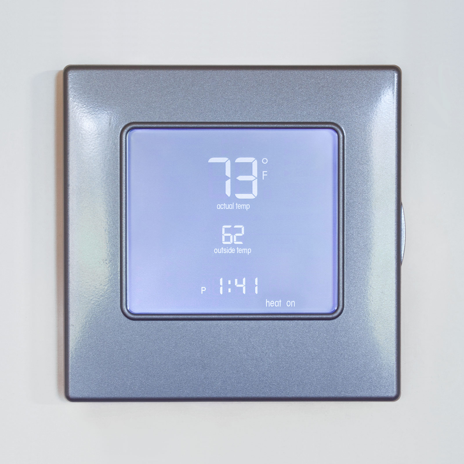 Room thermostat for panel heating with illuminated digital display